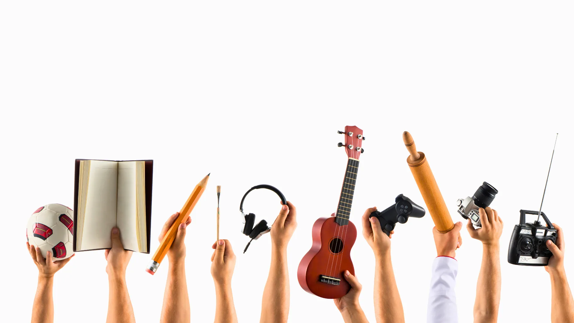 hobbies-instrumento-musical-escrever-ler-cozinhar-fotografar-pintar-atividades-criativas-bem-estar.jpg Imagem mostrando mãos praticando diferentes hobbies, simbolizando a diversidade de atividades criativas e o impacto positivo no bem-estar emocional.
